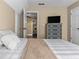 Bedroom featuring a closet, a TV, and access to an adjoining room at 212 Lakeview Dr, Newborn, GA 30056