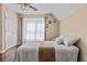Comfortable bedroom with a sloped ceiling, a closet, and a window with sheer curtains at 212 Lakeview Dr, Newborn, GA 30056