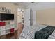 Bedroom featuring storage, television, hardwood floors, and neutral paint at 212 Lakeview Dr, Newborn, GA 30056