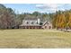 Charming brick home with a large front yard and a welcoming covered porch at 212 Lakeview Dr, Newborn, GA 30056
