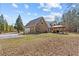 Stone house on large lot with attached garage and backyard pergola at 212 Lakeview Dr, Newborn, GA 30056