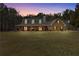 Charming front exterior with a covered porch and well-maintained landscaping at 212 Lakeview Dr, Newborn, GA 30056