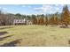 Sprawling front yard and lovely landscaping of a beautiful brick home at 212 Lakeview Dr, Newborn, GA 30056