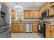Well-equipped kitchen with stainless steel appliances, granite countertops, and custom cabinetry at 212 Lakeview Dr, Newborn, GA 30056