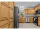 Beautiful kitchen featuring stainless steel appliances, custom cabinets, and tile flooring at 212 Lakeview Dr, Newborn, GA 30056