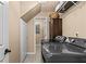 Functional laundry room with modern washer and dryer, storage shelves, and neutral wall color at 212 Lakeview Dr, Newborn, GA 30056