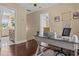 Home office area featuring neutral walls, hard wood floors, and an open doorway at 212 Lakeview Dr, Newborn, GA 30056
