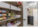 Organized pantry with shelving offering ample storage for food items and household supplies at 212 Lakeview Dr, Newborn, GA 30056