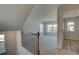 Upper hallway with carpet flooring and natural light, leading to adjacent rooms at 128 Dalston Cv, Stockbridge, GA 30281