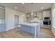 Modern kitchen with stainless steel appliances and gray cabinets at 128 Dalston Cv, Stockbridge, GA 30281