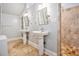 Bright bathroom featuring double sinks, tiled floor, and a glass-enclosed shower with tiled walls at 1883 Rugby Ave, Atlanta, GA 30337