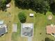 From above, discover a home with a large backyard including a pool, outbuildings, and well-kept landscaping at 709 Mohansic Ave, Loganville, GA 30052