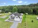Beautiful two-story home features a lush green lawn and convenient outbuildings, perfect for storage or hobbies at 709 Mohansic Ave, Loganville, GA 30052
