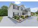 This two-story home boasts professional landscaping, a covered porch, and a long driveway at 709 Mohansic Ave, Loganville, GA 30052