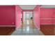 Spacious home foyer with hardwood floors and access to multiple rooms at 709 Mohansic Ave, Loganville, GA 30052