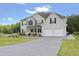 Charming two-story home boasting a well-maintained lawn, landscaping, and a two-car garage at 709 Mohansic Ave, Loganville, GA 30052