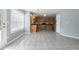 Open kitchen featuring tile floors, stainless steel appliances, and ample counter space at 709 Mohansic Ave, Loganville, GA 30052