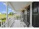 Inviting covered front porch with seating and decorative plants at 709 Mohansic Ave, Loganville, GA 30052