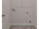 Compact laundry room featuring tile floors and utility hookups, ready for appliances at 8592 Secretariat Dr, Lithonia, GA 30058