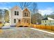 Modern duplex with a spacious driveway, new fence, and distinct light and dark siding at 1106B Wedgewood Nw Dr, Atlanta, GA 30318