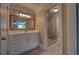 Bright bathroom with a marble countertop, white cabinetry, and glass enclosed shower at 1261 William Robert Sw Dr, Marietta, GA 30008
