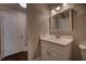 Neutral powder room features a marble countertop, updated fixtures and white vanity at 1261 William Robert Sw Dr, Marietta, GA 30008
