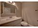 Neutral powder room features a marble countertop and white vanity at 1261 William Robert Sw Dr, Marietta, GA 30008