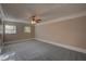 Bedroom with neutral paint, carpet, crown moulding and ceiling fan with light at 1261 William Robert Sw Dr, Marietta, GA 30008