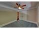 Bedroom with neutral paint, carpet, crown moulding, ceiling fan with light and closet at 1261 William Robert Sw Dr, Marietta, GA 30008