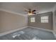 Bedroom with neutral paint, carpet, crown moulding and ceiling fan with light at 1261 William Robert Sw Dr, Marietta, GA 30008