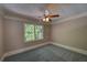 Bedroom with neutral paint, carpet, crown moulding and ceiling fan with light at 1261 William Robert Sw Dr, Marietta, GA 30008