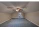 Bonus room with neutral paint, carpet, and ceiling fan with light fixture at 1261 William Robert Sw Dr, Marietta, GA 30008