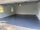 Clean and bright garage featuring a blue epoxy floor at 1261 William Robert Sw Dr, Marietta, GA 30008