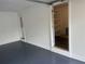 Clean and bright garage featuring a blue epoxy floor and walk-in pantry at 1261 William Robert Sw Dr, Marietta, GA 30008