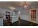 Updated kitchen features stainless steel appliances, white cabinets, an island, and access to the backyard at 1261 William Robert Sw Dr, Marietta, GA 30008