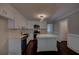 Bright kitchen with stainless steel appliances, white cabinetry, island, and dark hardwood floors at 1261 William Robert Sw Dr, Marietta, GA 30008
