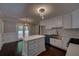 Bright kitchen features white cabinets, an island, stainless steel appliances, and dark hardwood floors at 1261 William Robert Sw Dr, Marietta, GA 30008