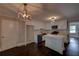 Bright renovated kitchen features white cabinets, an island, stainless steel appliances, and dark hardwood floors at 1261 William Robert Sw Dr, Marietta, GA 30008