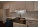 Updated kitchen with stainless steel farmhouse sink, white cabinets, and marble countertops at 1261 William Robert Sw Dr, Marietta, GA 30008