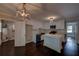 Bright renovated kitchen features white cabinets, an island, stainless steel appliances, and dark hardwood floors at 1261 William Robert Sw Dr, Marietta, GA 30008