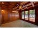 Cozy sunroom featuring wood paneled walls and ceiling and tile floors at 1261 William Robert Sw Dr, Marietta, GA 30008