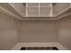 Spacious walk-in closet with built in shelving and shoe storage at 1261 William Robert Sw Dr, Marietta, GA 30008