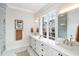 Bright bathroom with double sinks, large window, and modern finishes at 229 Dovecrest Nw Dr, Atlanta, GA 30305