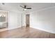Bedroom with doorway to bathroom, hardwood flooring, and ceiling fan at 229 Dovecrest Nw Dr, Atlanta, GA 30305