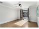 Bedroom with wood floors and recessed lighting, featuring french doors that lead to the patio at 229 Dovecrest Nw Dr, Atlanta, GA 30305