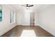 Bright bedroom with wood floors featuring access to an ensuite bathroom and a large window at 229 Dovecrest Nw Dr, Atlanta, GA 30305