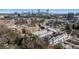 An aerial view of a city skyline with several buildings and busy streets at 229 Dovecrest Nw Dr, Atlanta, GA 30305