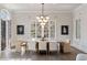 Elegant dining area with stylish lighting, hardwood floors, and an open layout at 229 Dovecrest Nw Dr, Atlanta, GA 30305