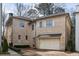 Two-story home with a two-car garage and brick driveway at 229 Dovecrest Nw Dr, Atlanta, GA 30305