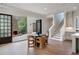 Open-concept living space with fireplace and large doors opening to the patio at 229 Dovecrest Nw Dr, Atlanta, GA 30305